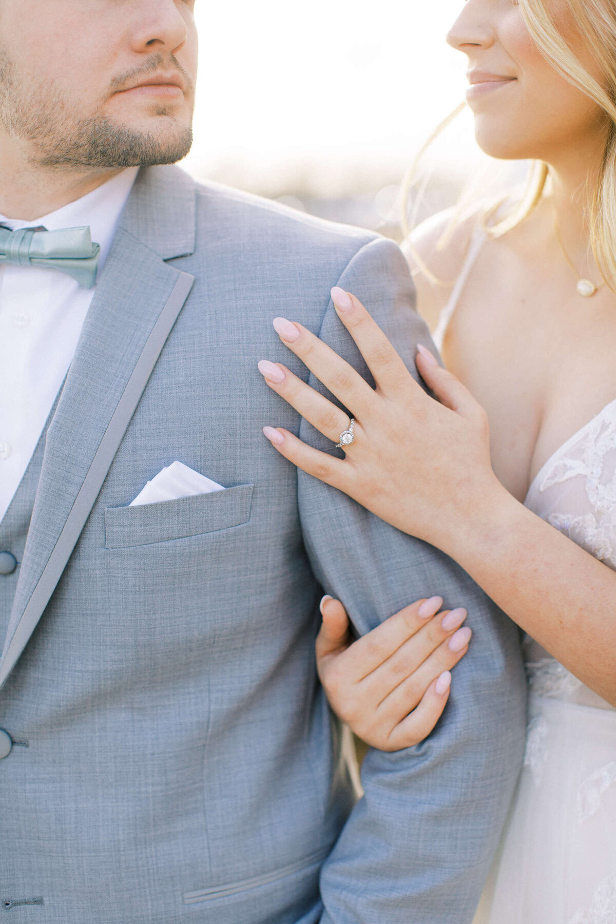 Bride places hands on groom's shoulder at January wedding in North Texas