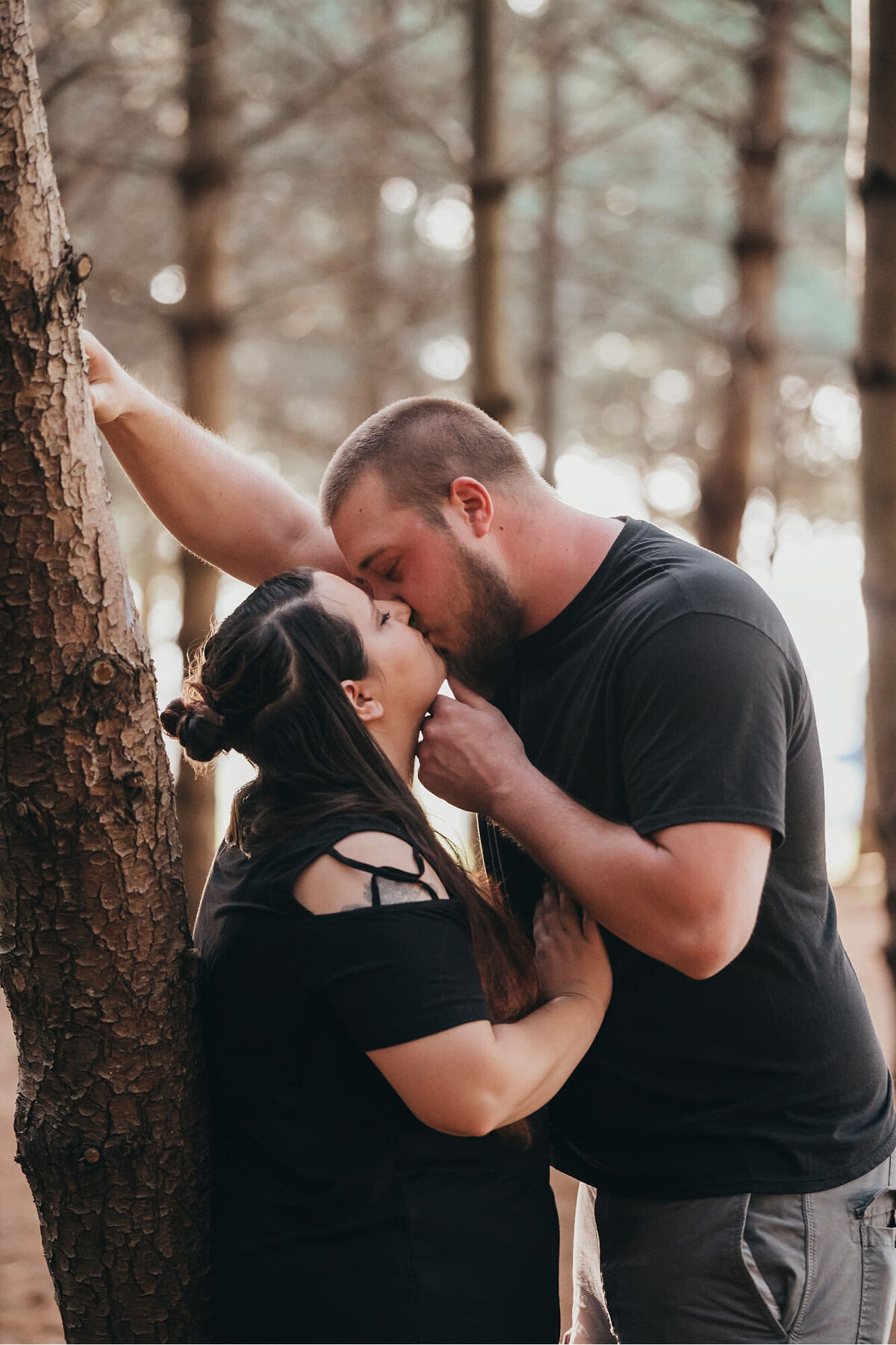 casual engagement session near a tree