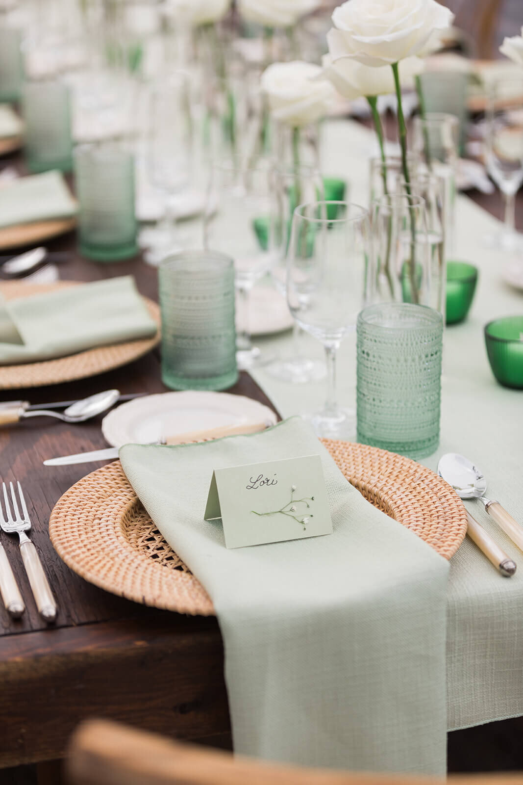 Wedding reception table scape with olive green napkins