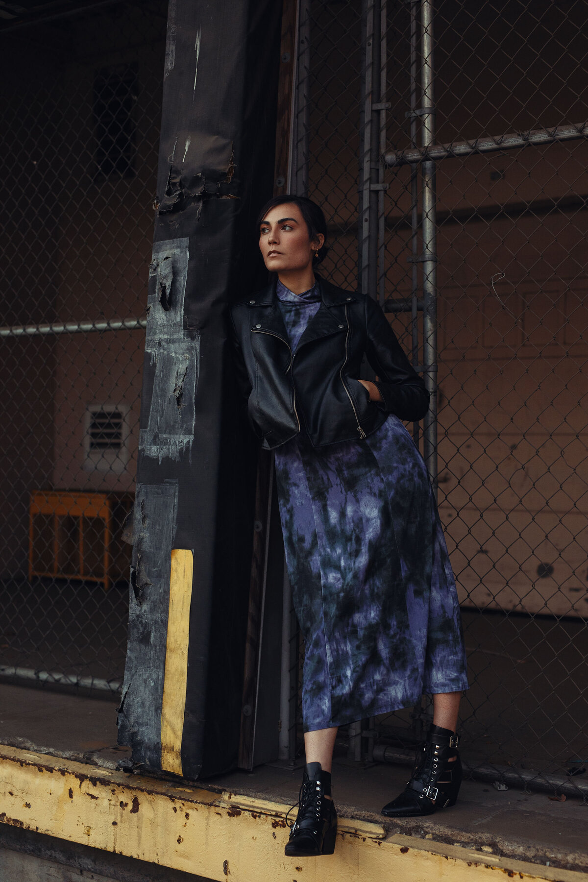 Portrait Photo Of Young Woman Leaning Against a Post Los Angeles