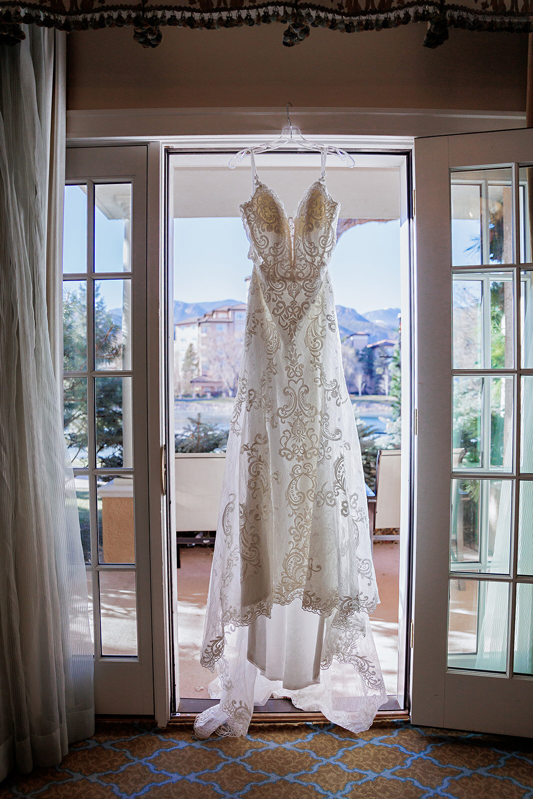 White lace straight wedding dress in the window at The Broadmoor Hotel in Colorado Springs, Colorado.