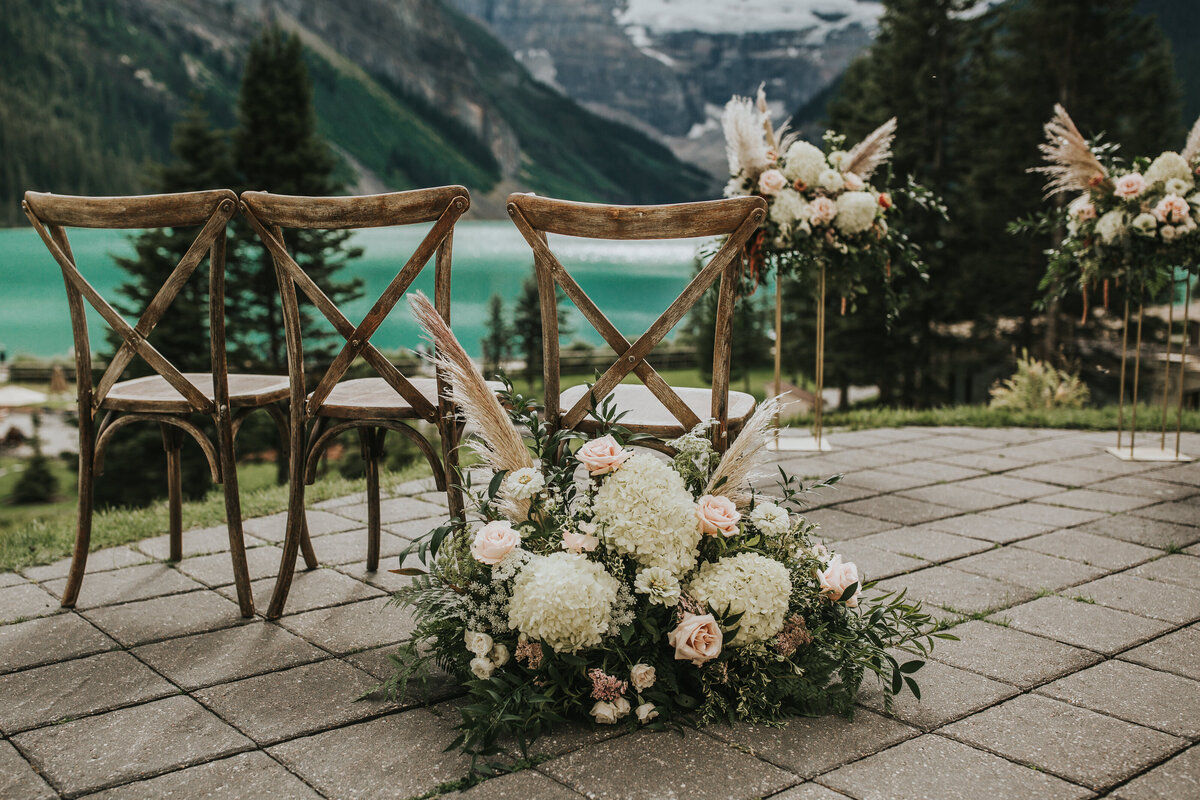 Gorgeous white and pink florals at mountain ceremony by Moments by Madeleine, a romantic and elegant wedding planner based in Calgary, Alberta. Featured on the Brontë Bride Vendor Guide.