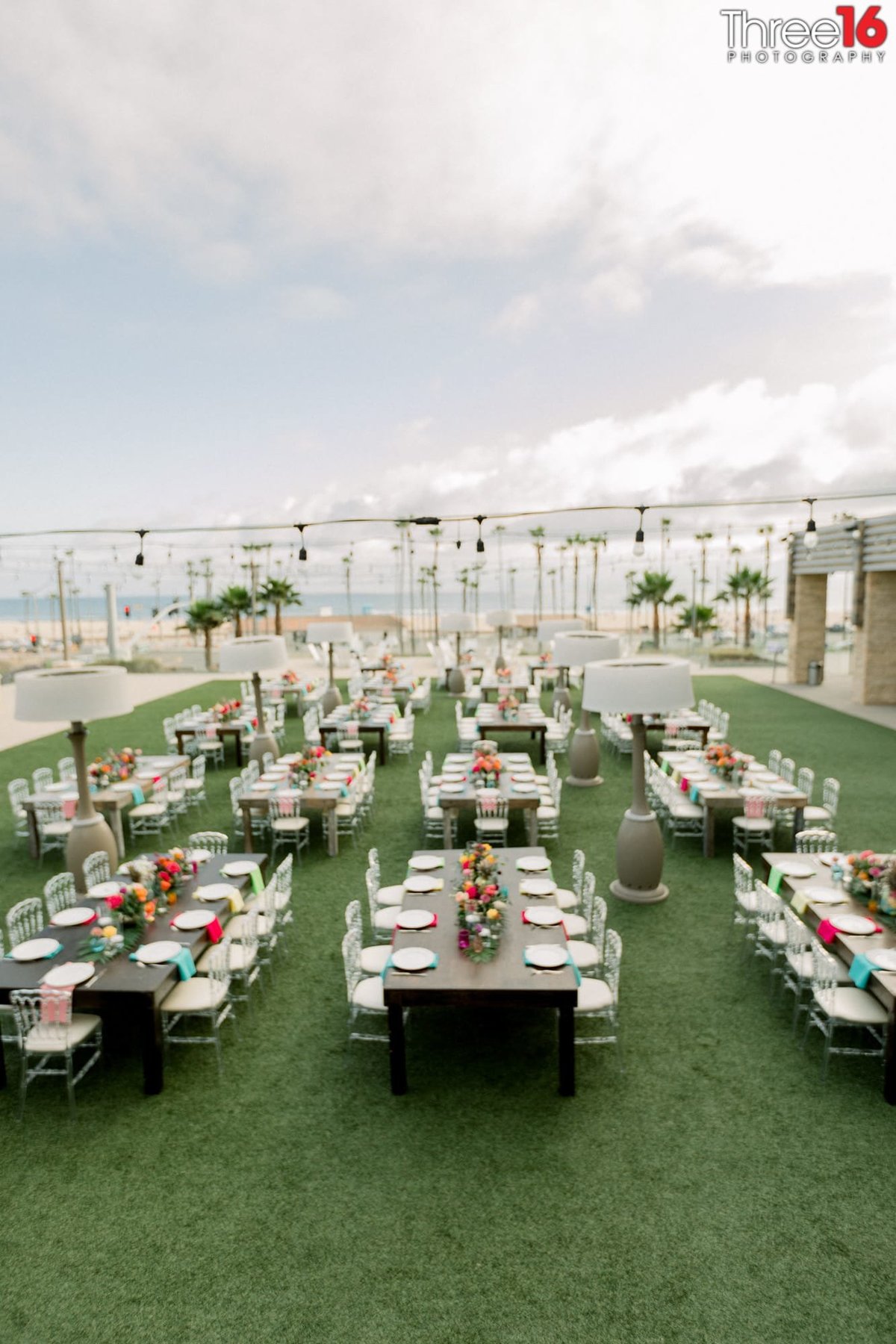 Aerial view of a wedding reception setup on the rooftop of the Pasea Hotel in Huntington Beach