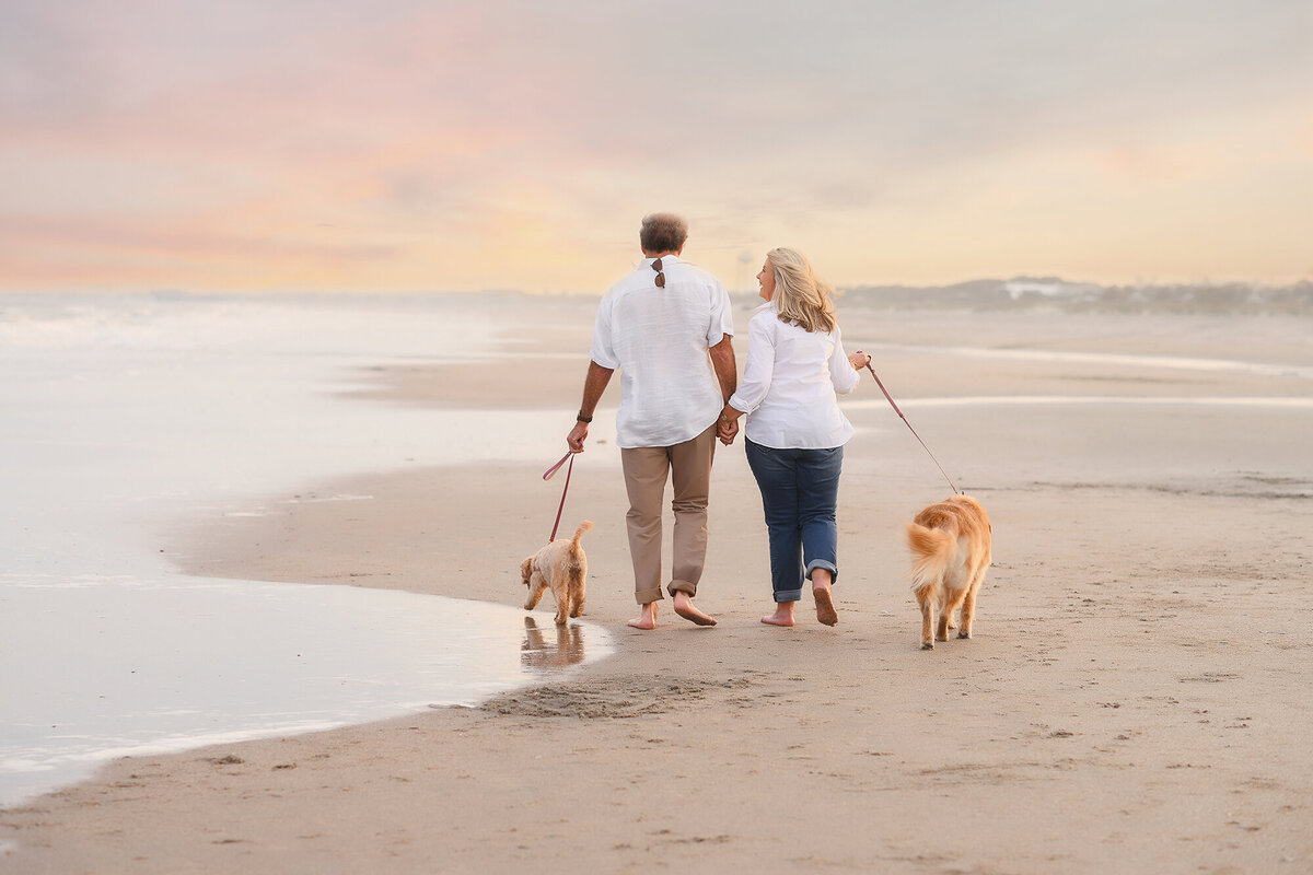 Elderly couple walks along Isle of Palms beach together during their Family Photoshoot on Isle of Palms.