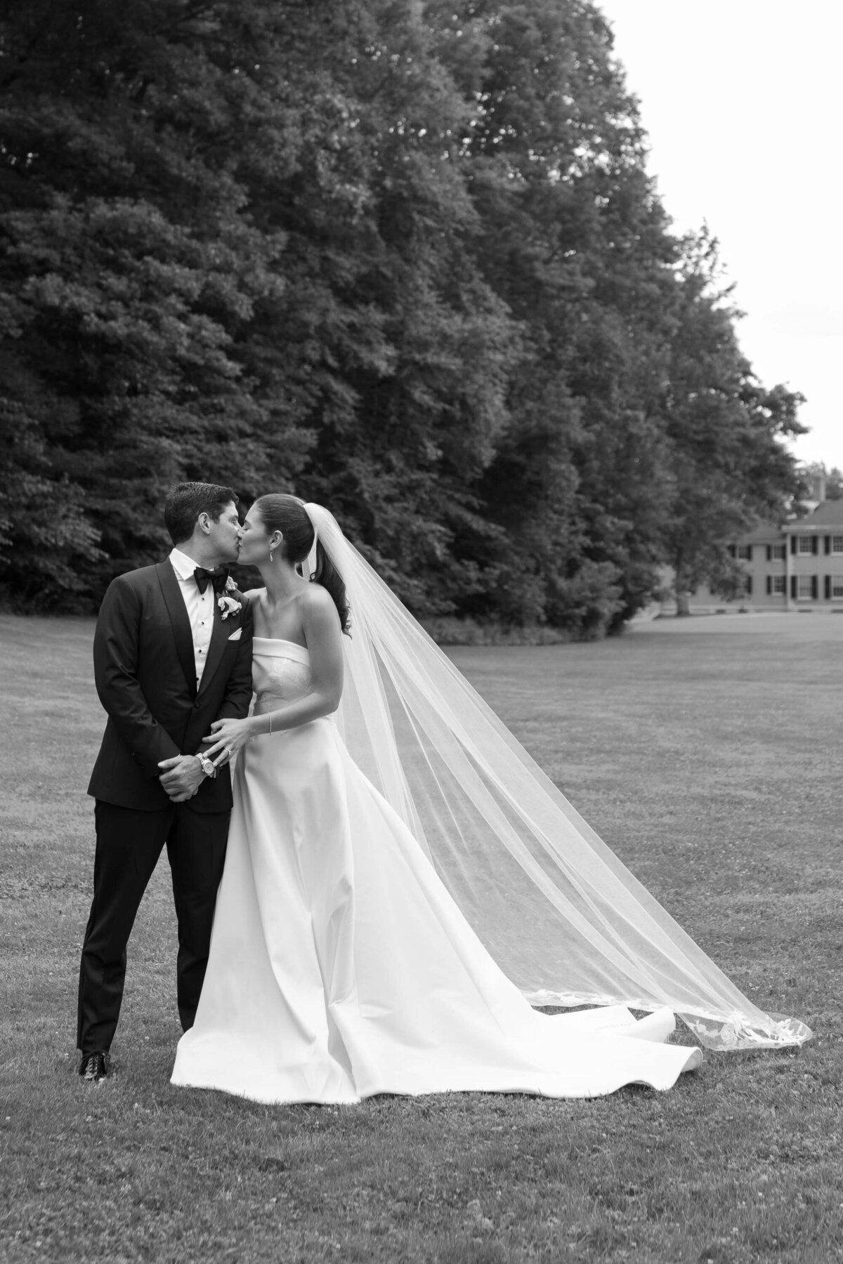 bride and groom walk through the gardens at hildene wedding in manchster, vt