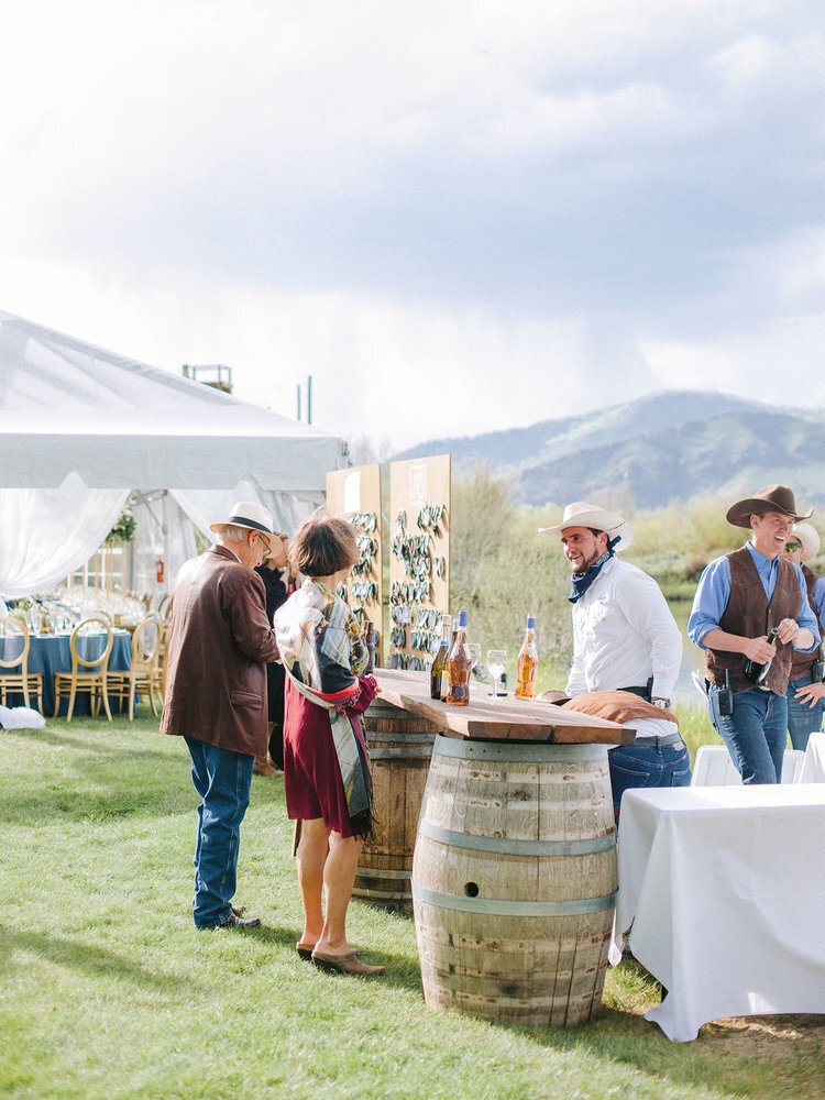 Outdoor barrel tables at a Colorado ranch wedding venue