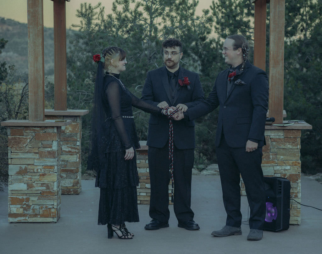 A couple during a hand fasting ceremony