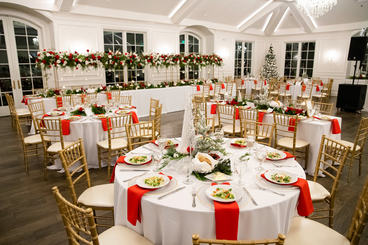 red and white Christmas themed wedding reception set up