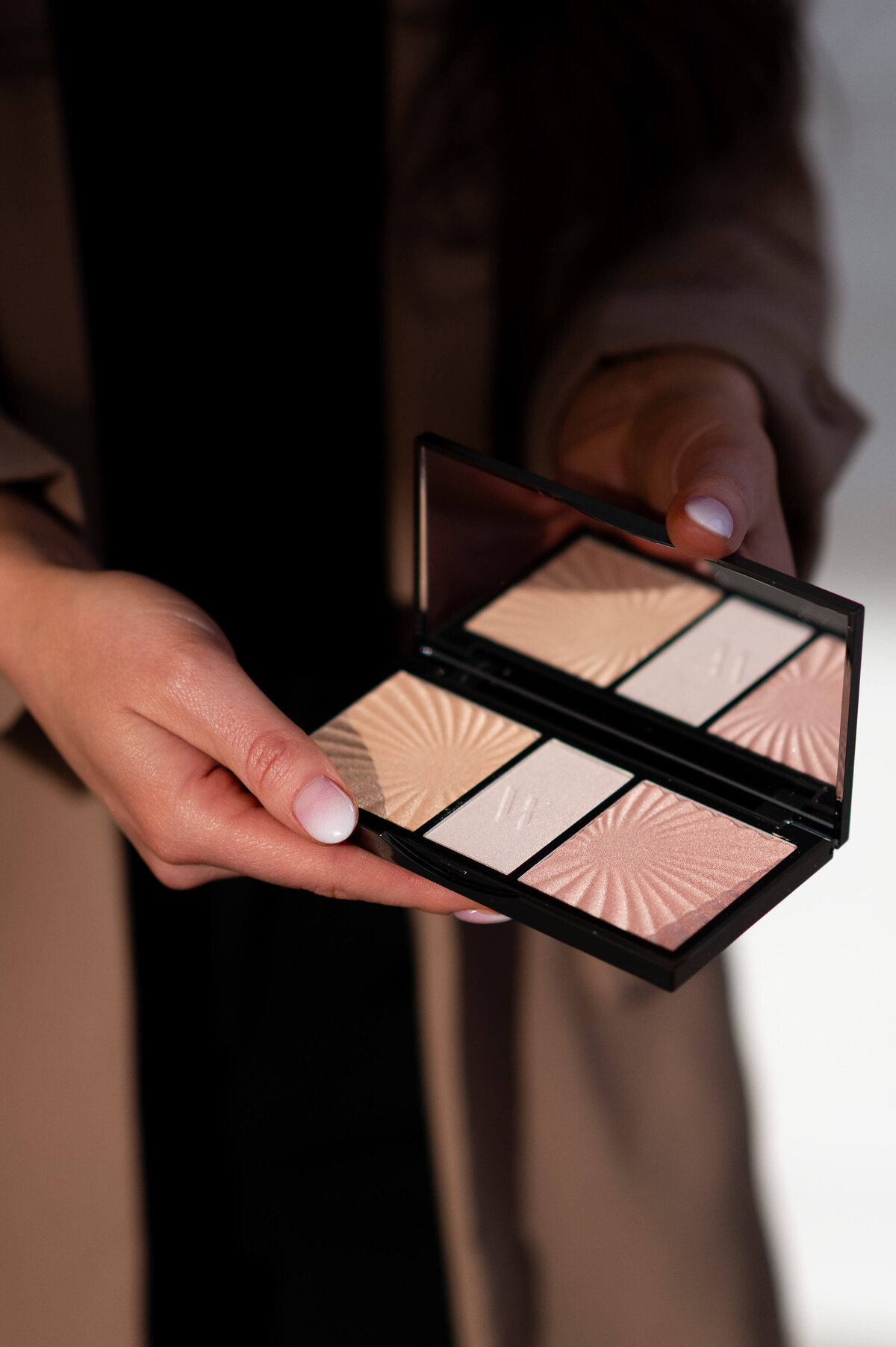 Ottawa brand photos of a compact of eyeshadow in an artist's hands.  Captured by JEMMAN Photography COMMERCIAL