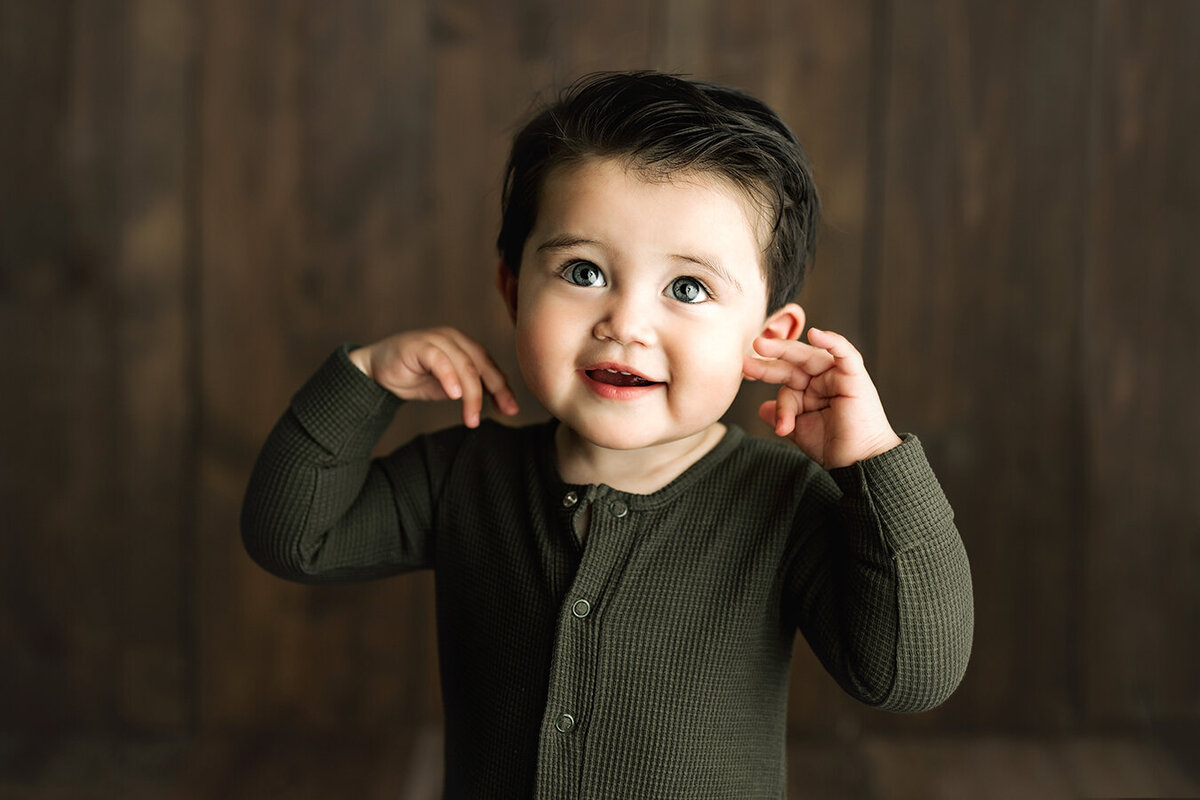 Adorable baby boy in photography studio