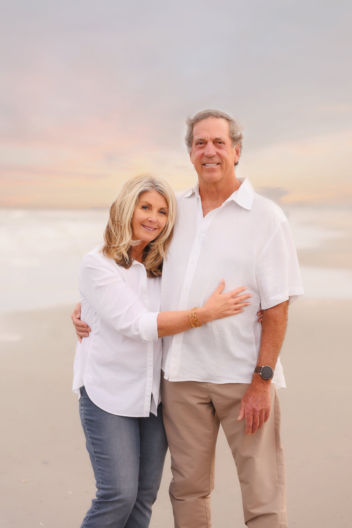 Elderly couple poses for Family Pictures during Family Photoshoot on Isle of Palms. 