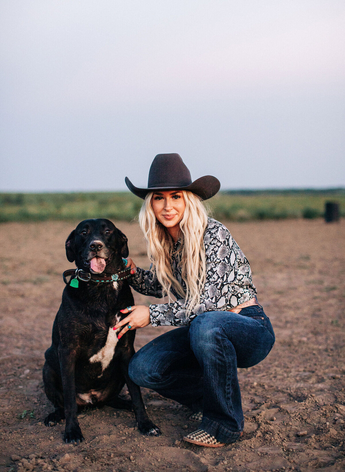 cowgirl posing with dog