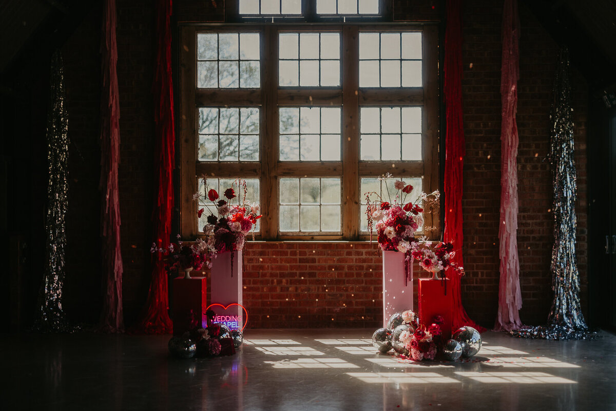 Pink and red Las Vegas Chapel style ceremony at The Giraffe Shed. 