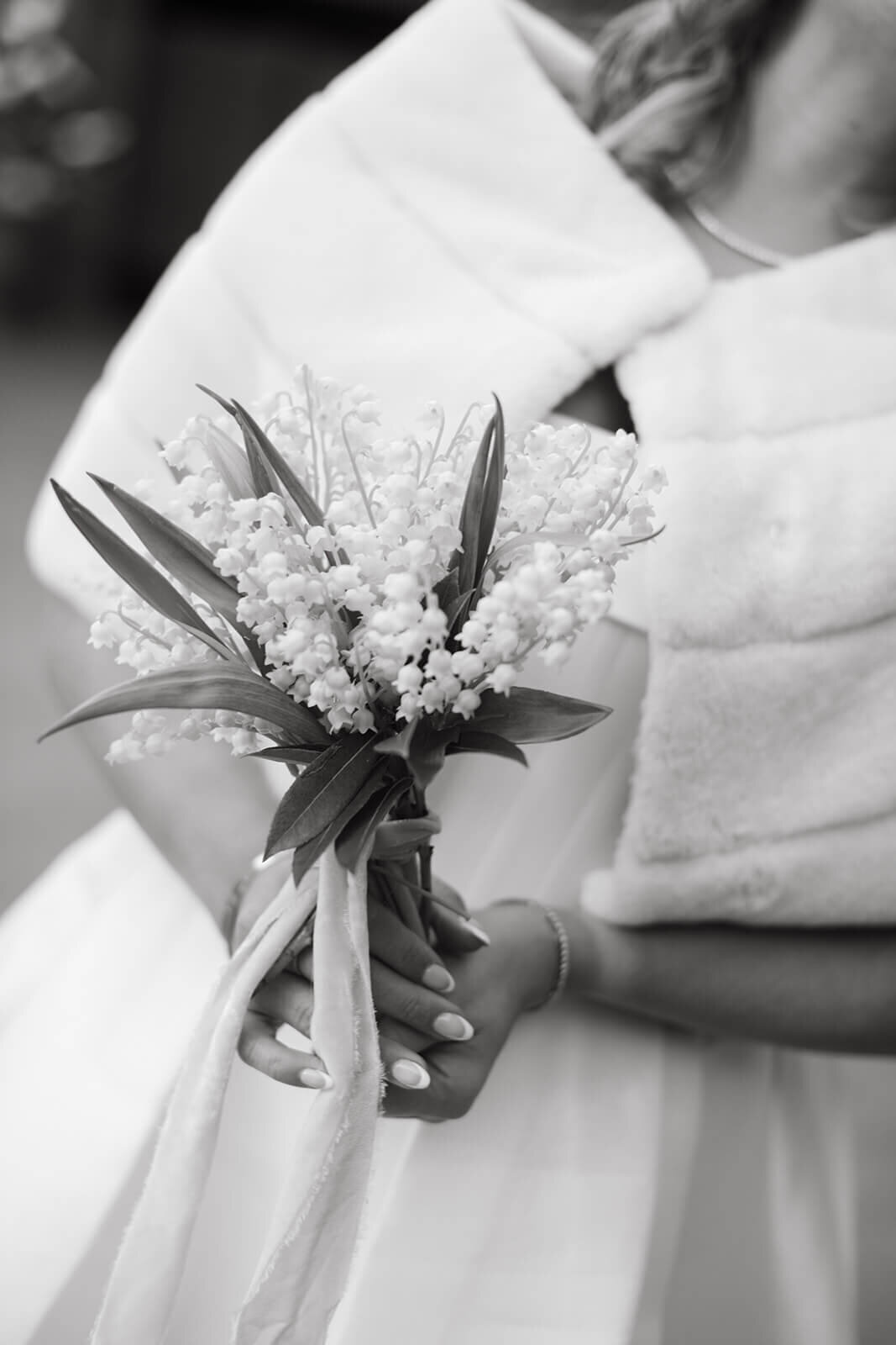 Bridal bouquet with white and pastel flowers, captured at St. Regis Aspen, featuring elegant floral design and romantic details.
