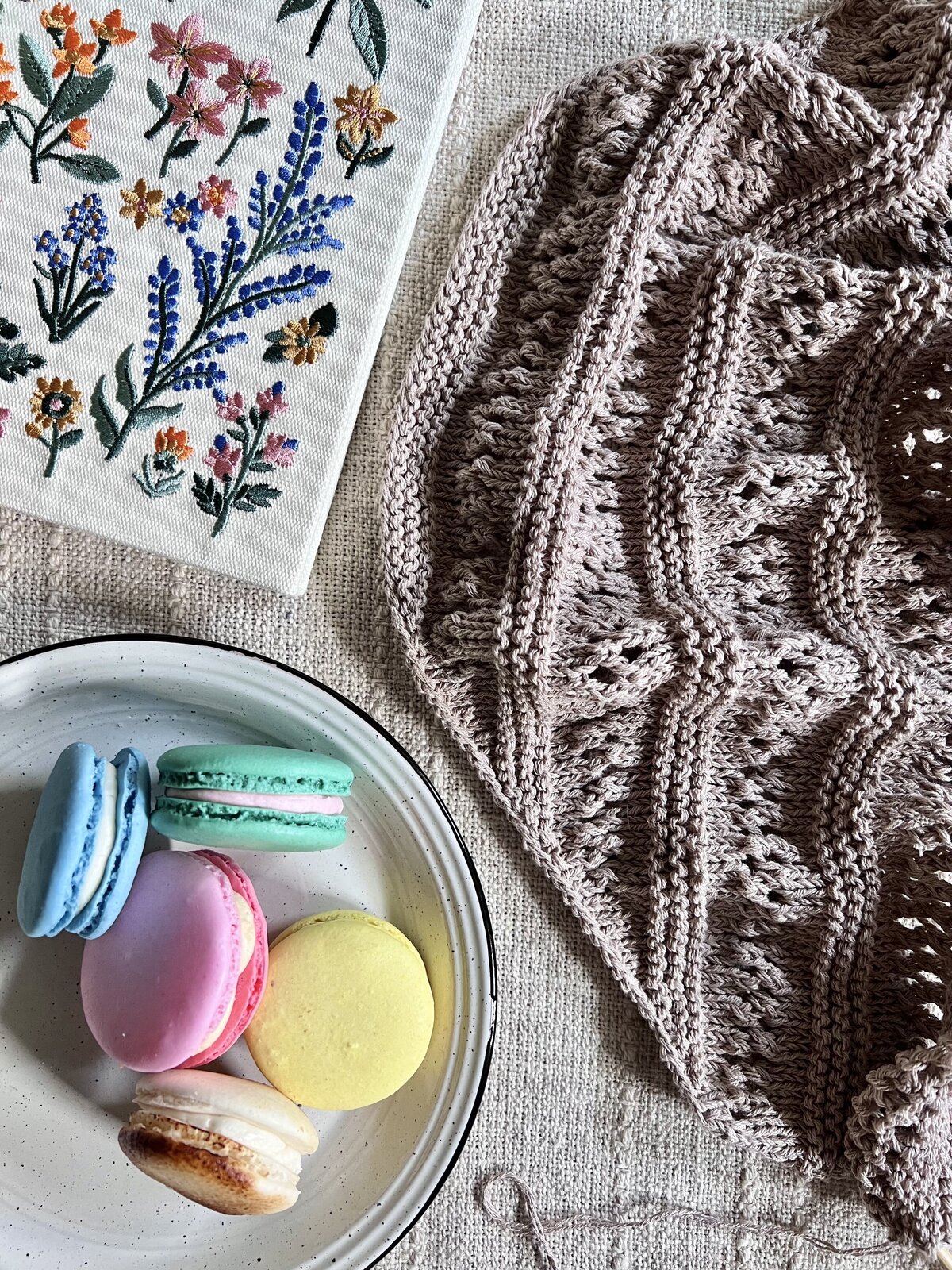 Lexie Dane Knitting WIP laid out on the table in a lifestyle photo
