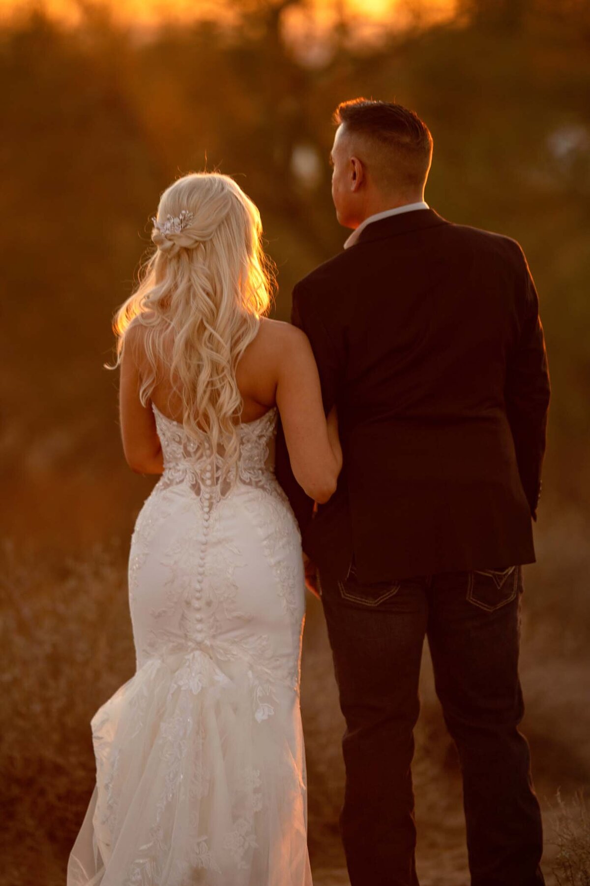 Arizona elopement glowing photo of groom and bride during golden hour