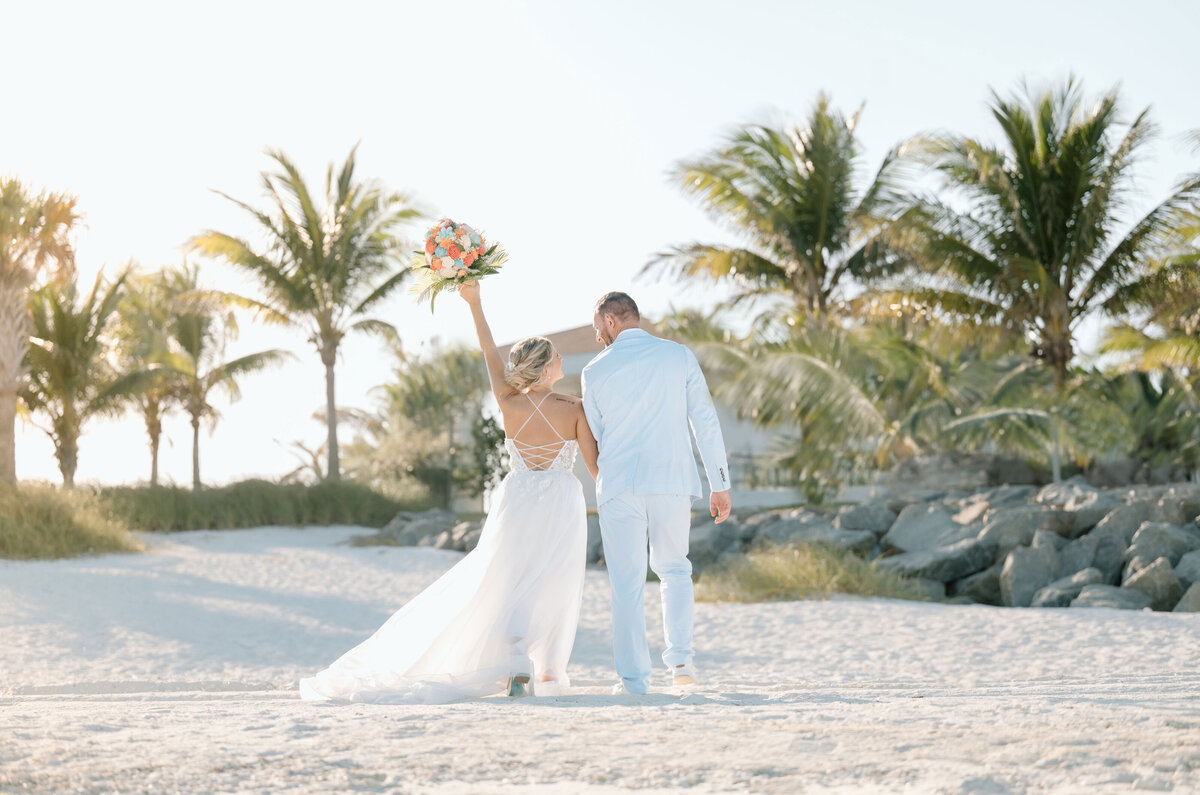 a bride and groom at their wedding in the Bahamas with a destination wedding photographer