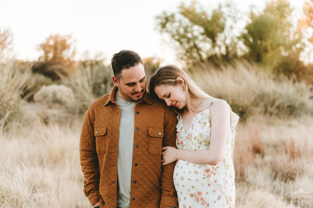 husband and wife embracing during a fall session