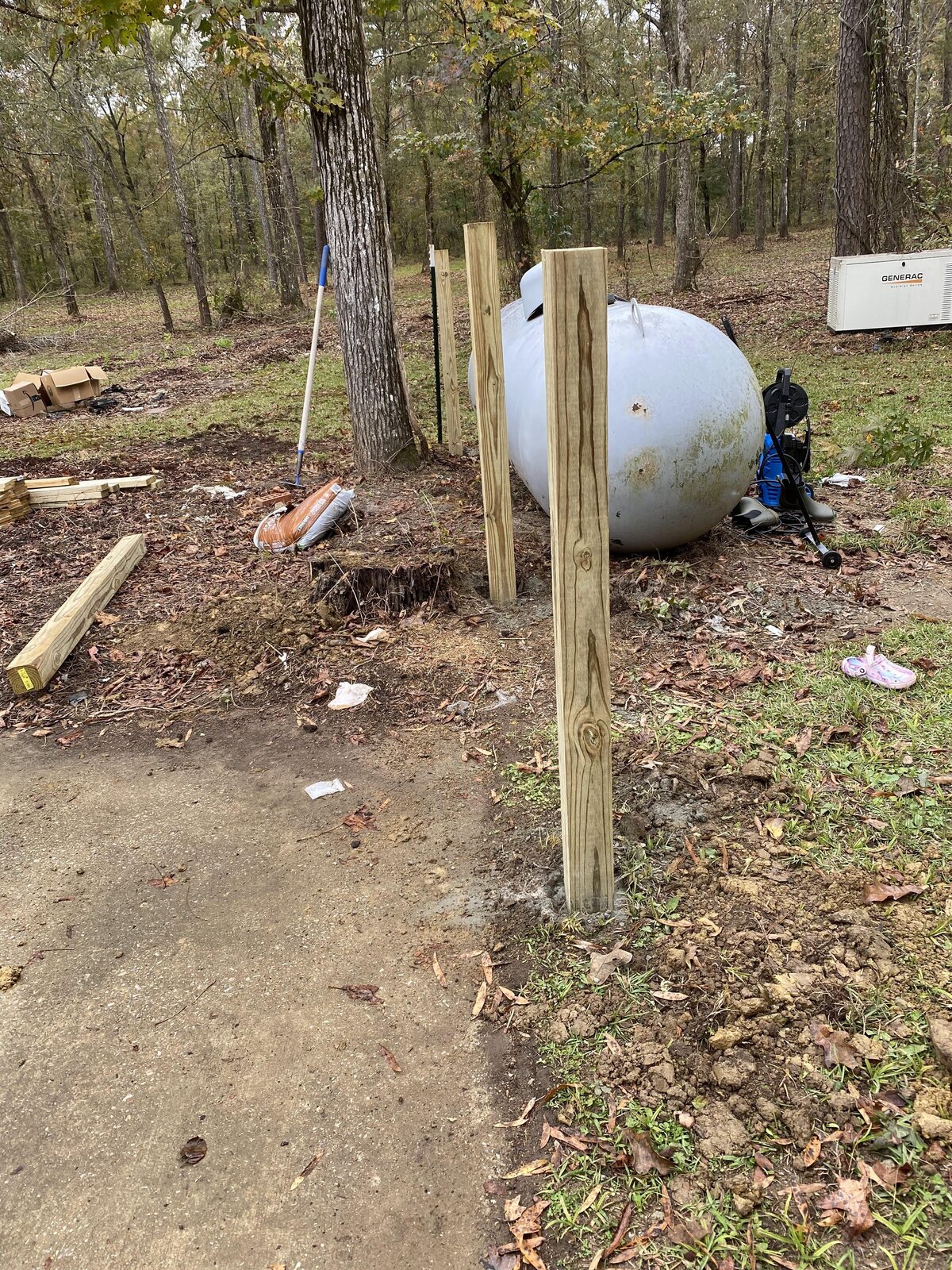 septic-tank-next-to-wooden-posts