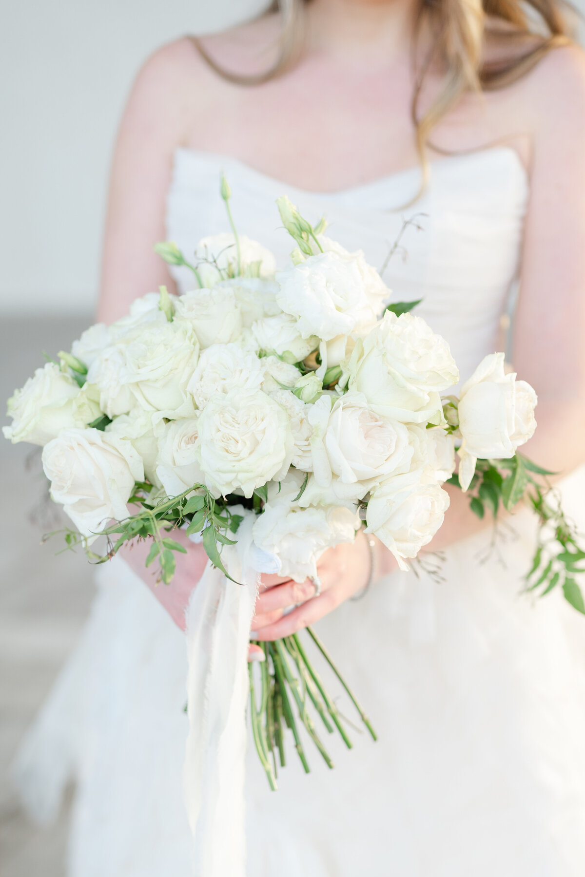 Classic white bouquet held by bride by Springfield Illinois wedding photographers Lacey Graham