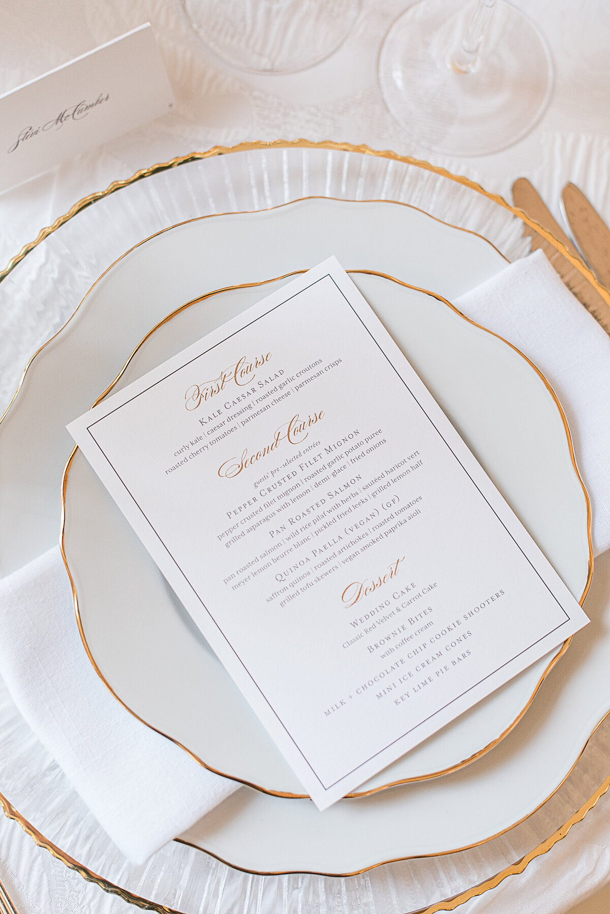 gold and white dinner seating menu