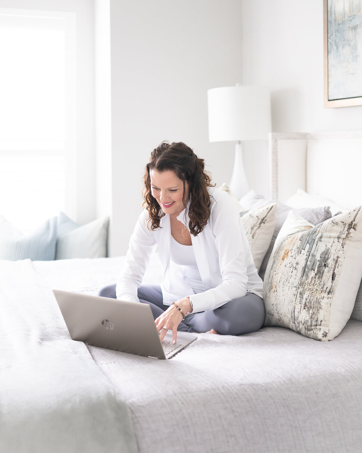 business owner getting her work done on master bed