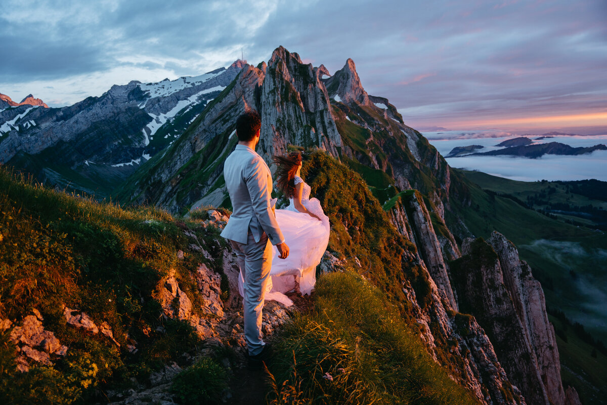 Couple eloping in the Swiss Alps during sunset with Appenzell in the background