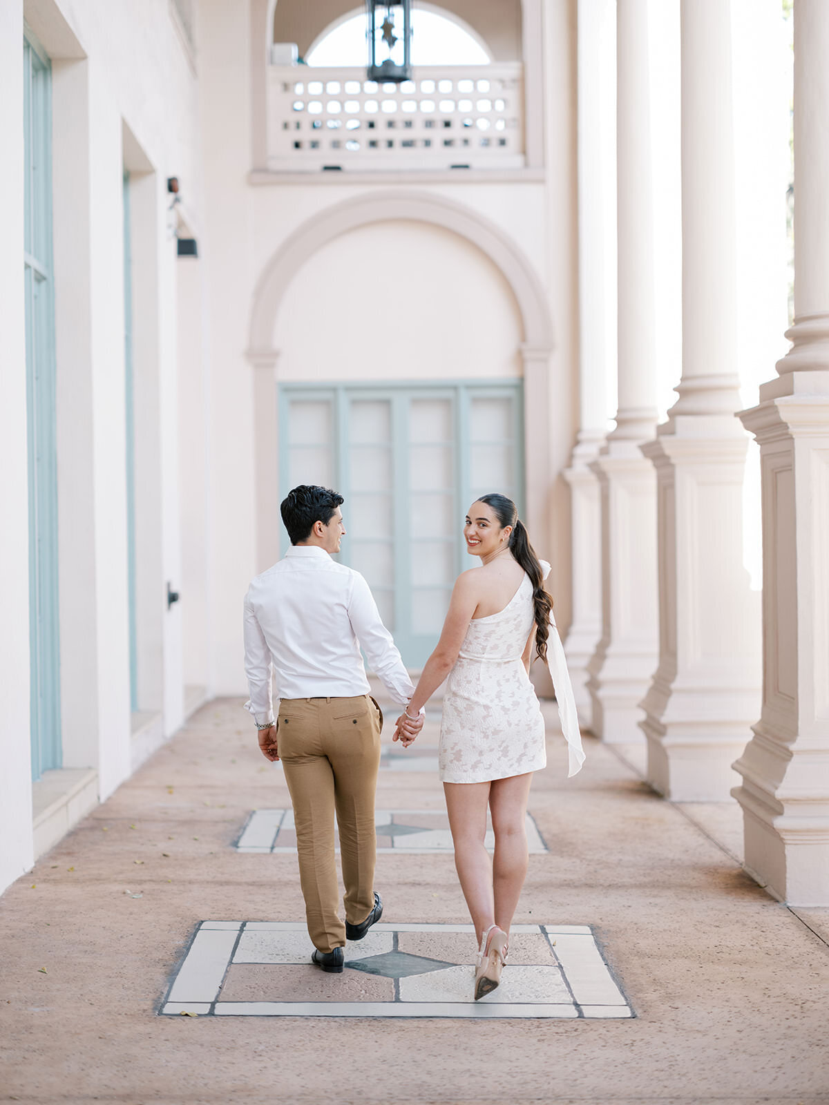 couple-walk-hand-in-hand-2SA-RD