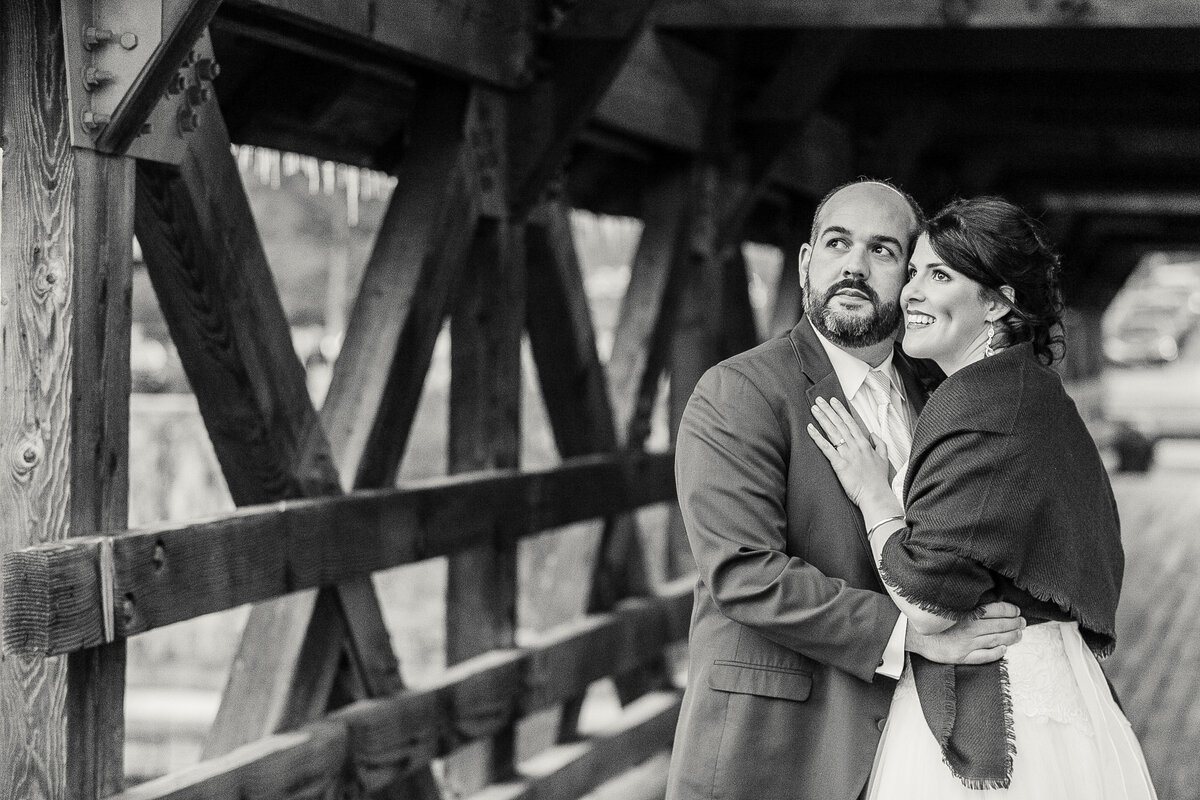 njeri-bishota-lauren-ashley-bride-groom-wooden-bridge-looking-off-and-away