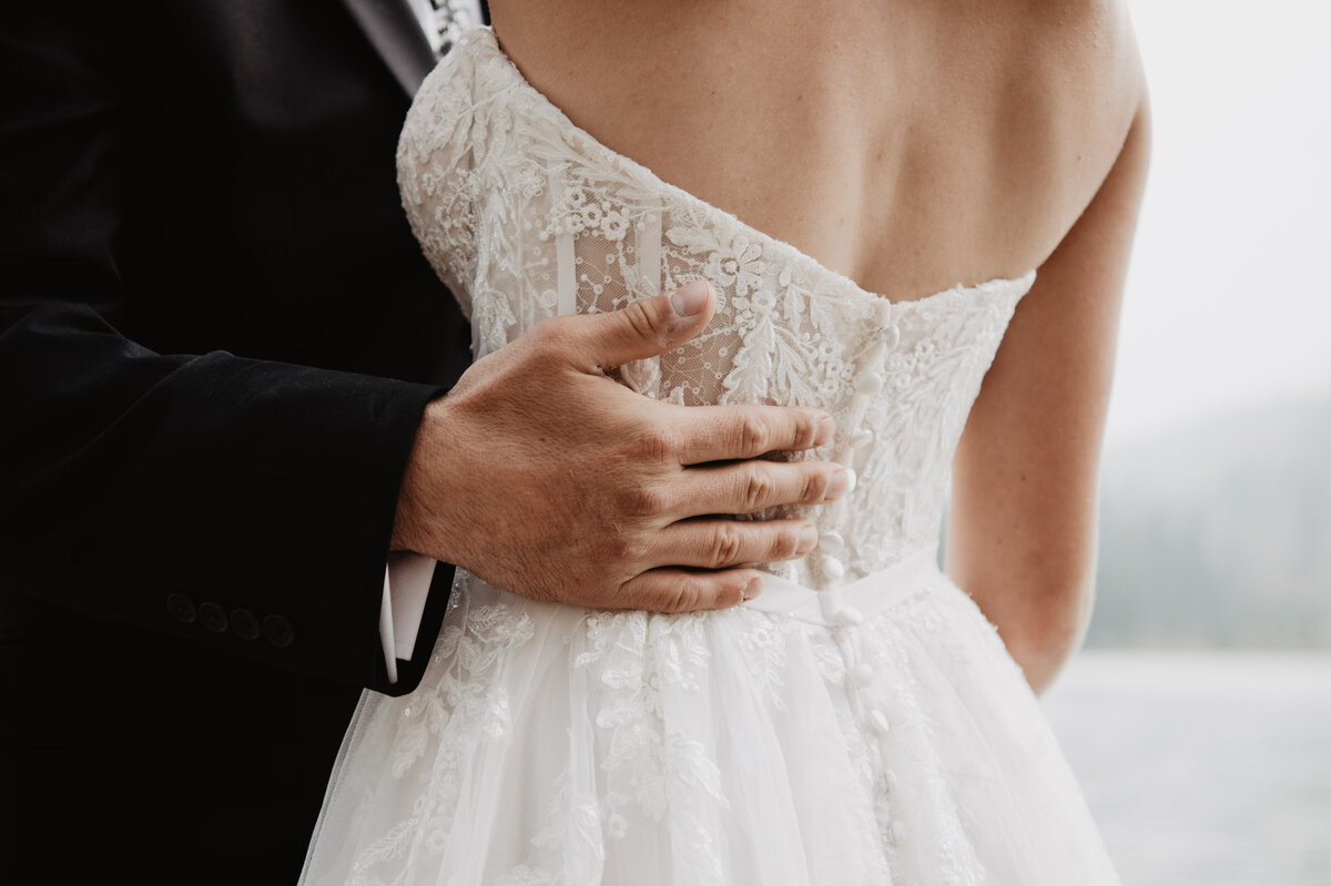 Jackson Hole Photographers capture groom holding bride's waist
