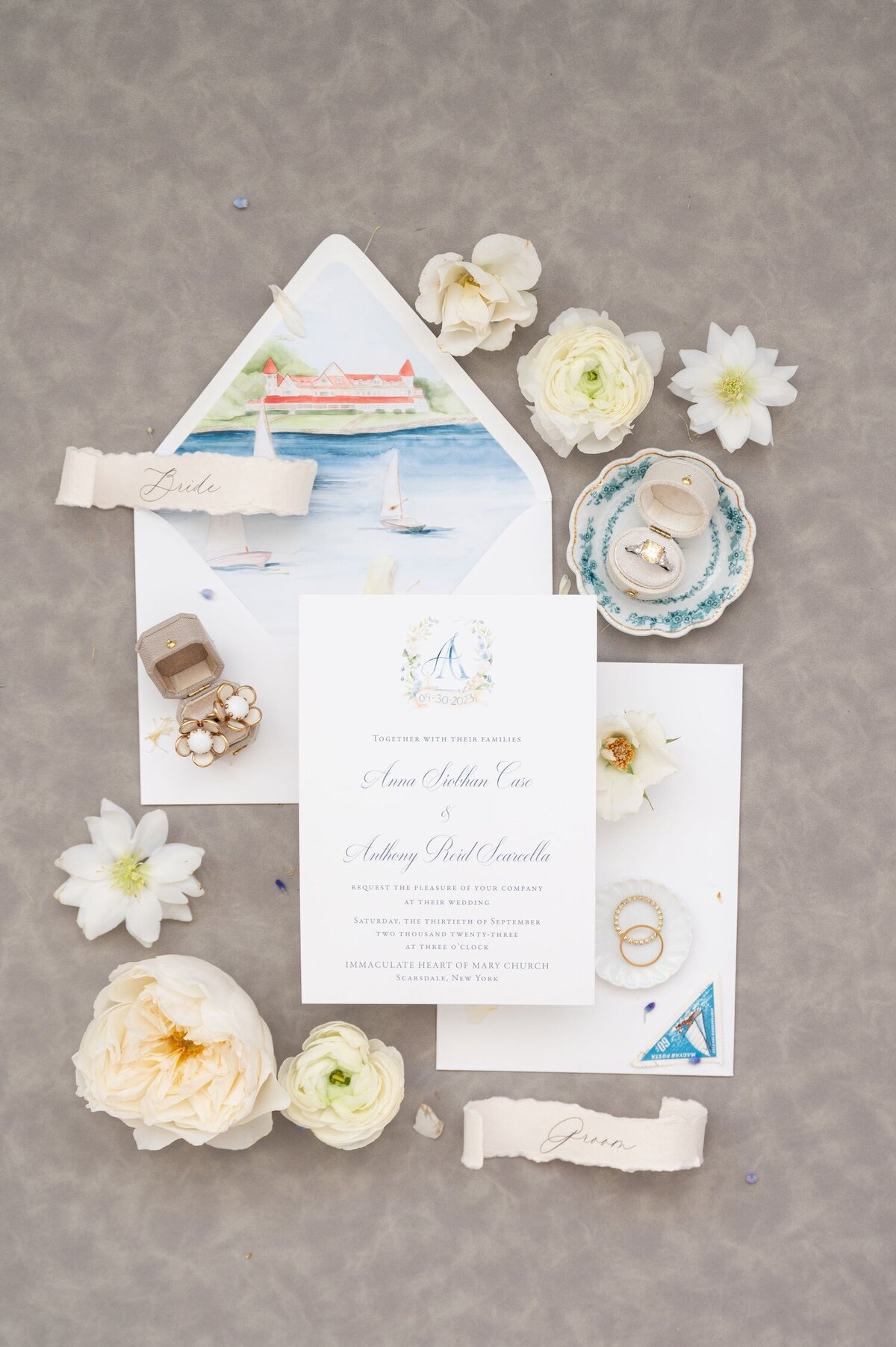 A coastal and romantic wedding invitation flat lay.
