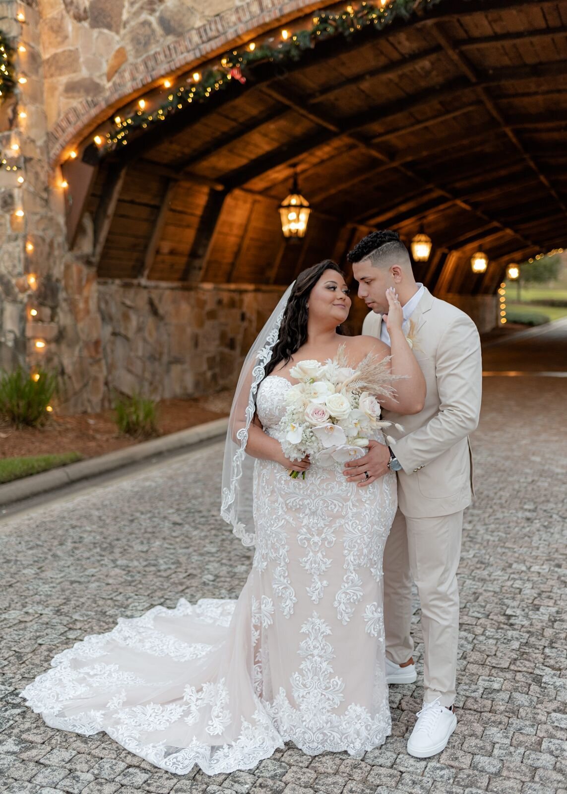 Bride and Groom under bridge at Bella Collina in Montverde, Fl