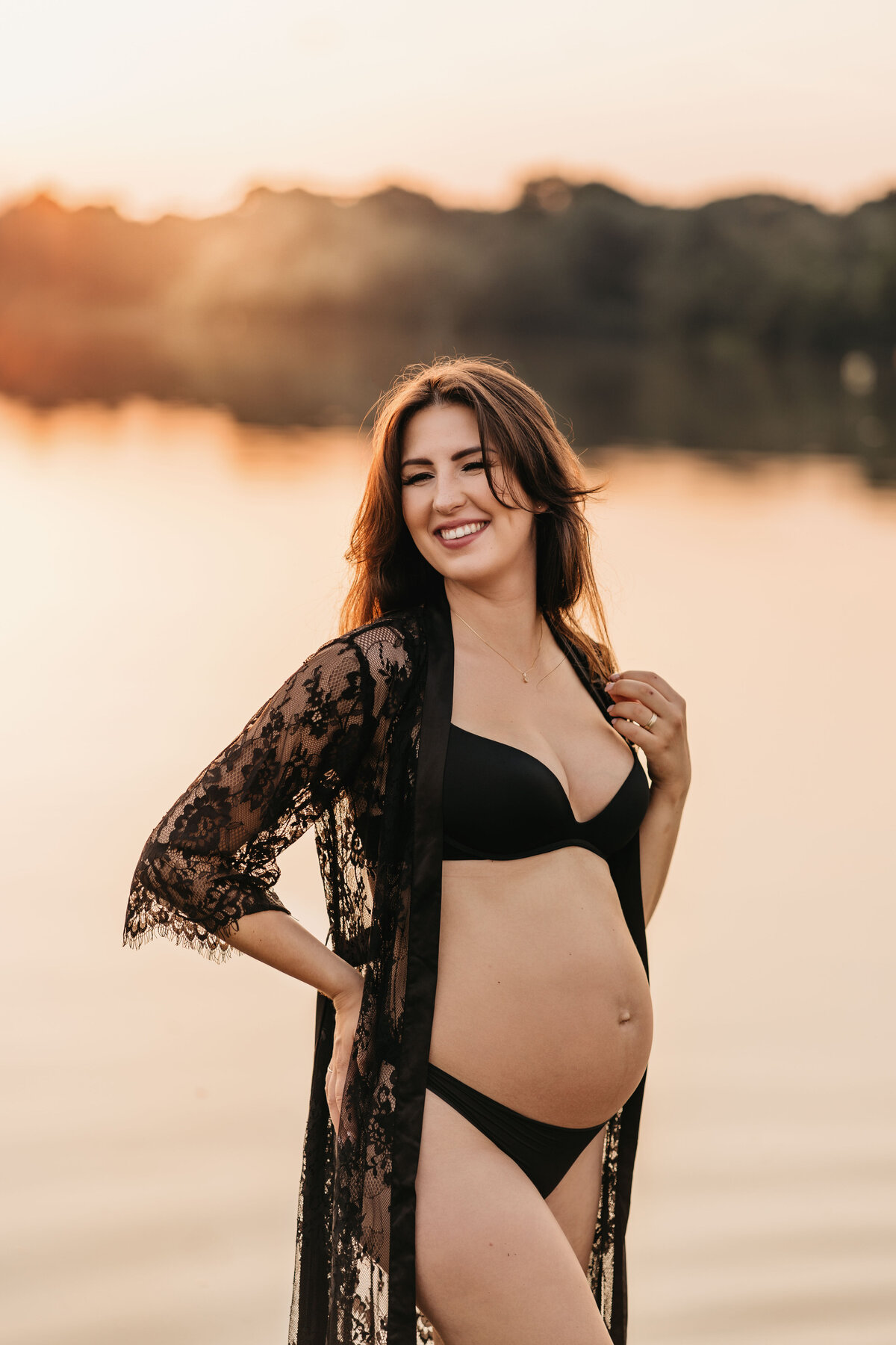 Photo of a pregnant woman standing in a lake