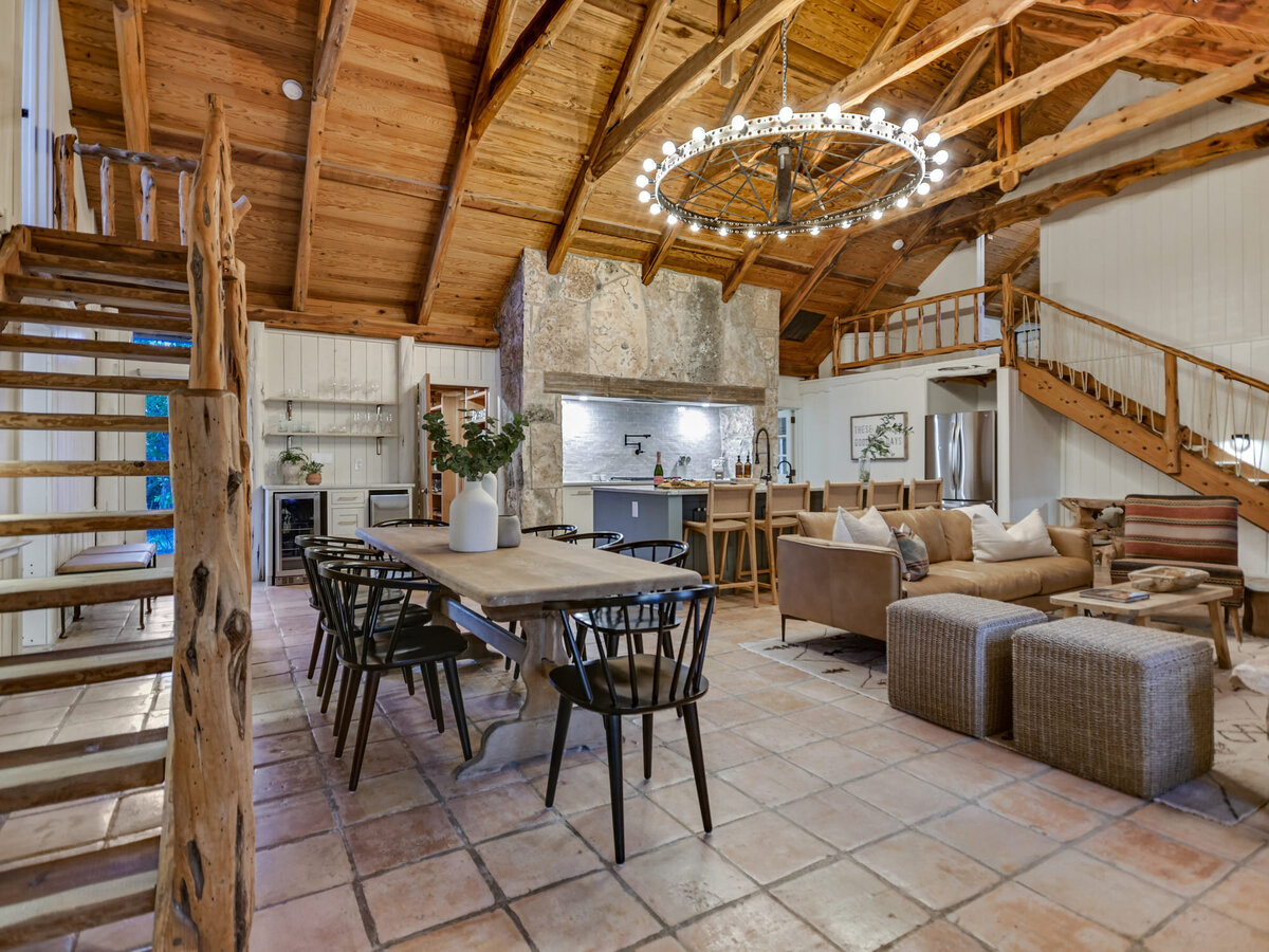 Dining room and living area with large vaulted ceiling