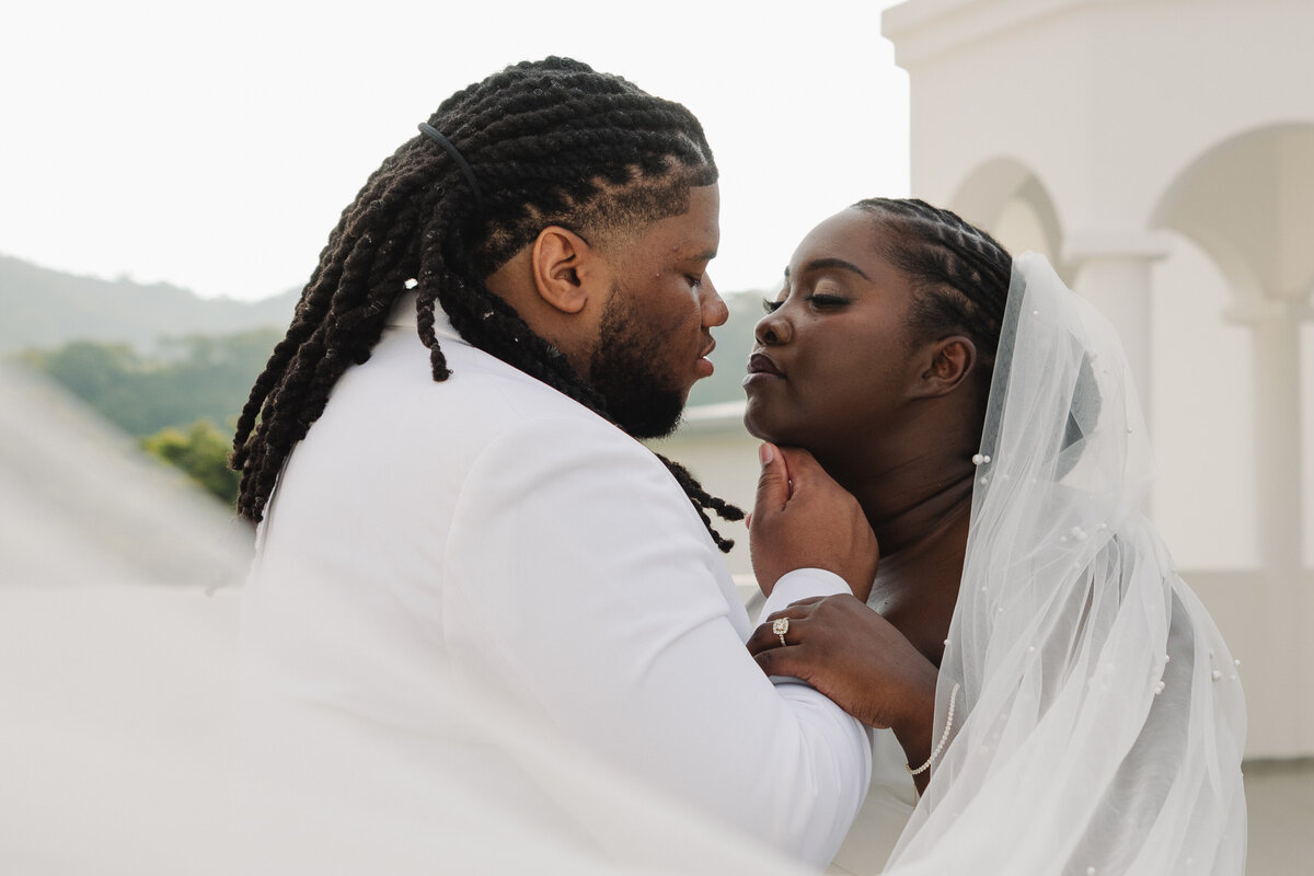 bride and groom embrace after destination wedding ceremony