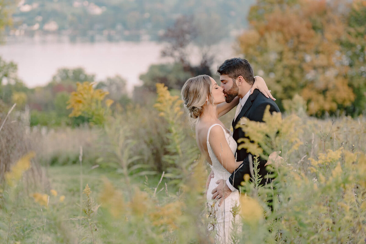 Bride and groom kissing at Finger Lakes Wedding