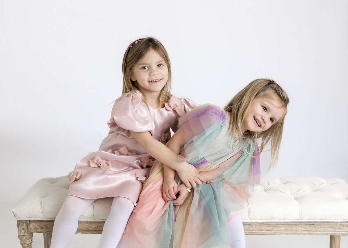 Portrait of smiling siblings at Allison Reilly's Union County, NJ photo studio.