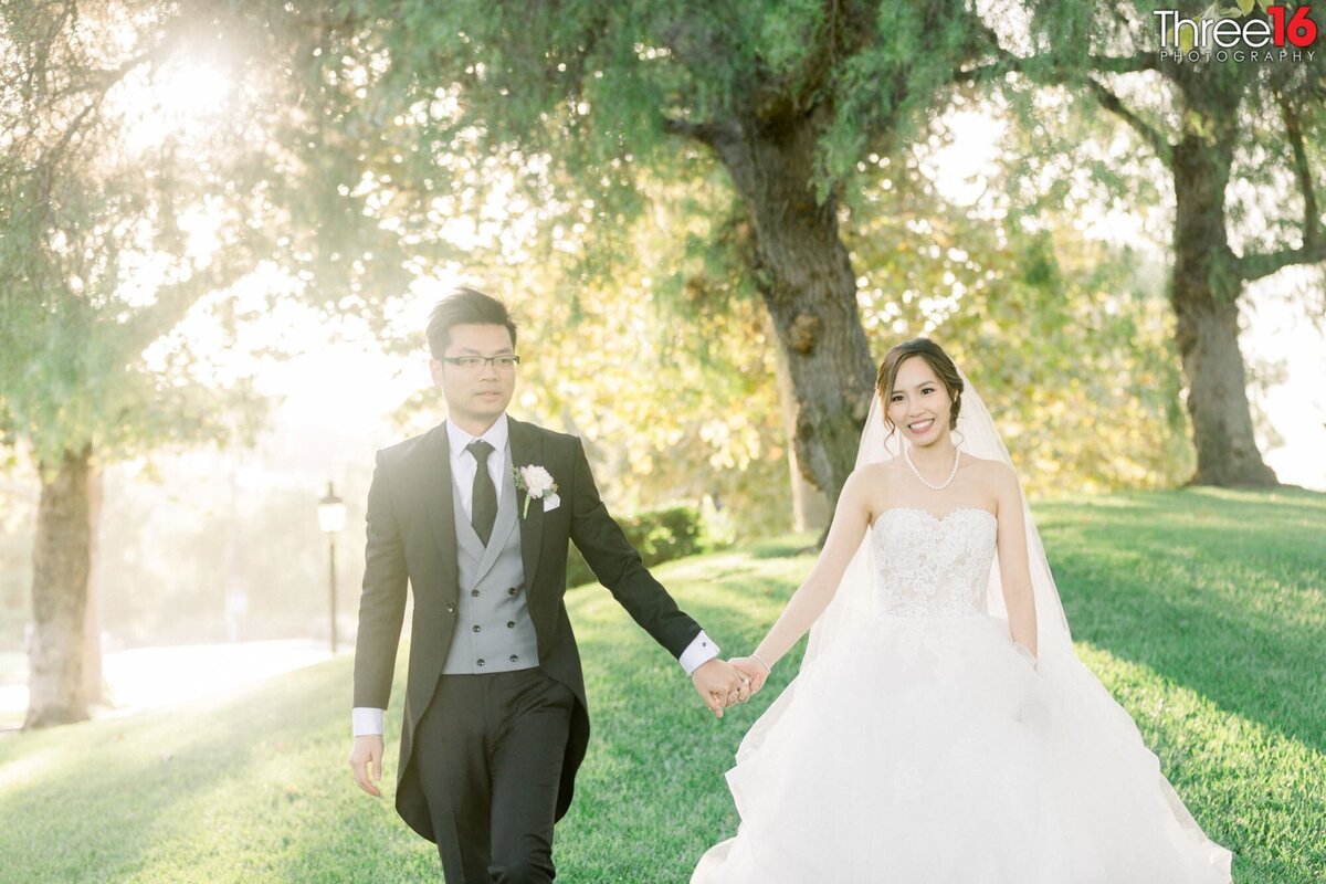 Bride and Groom go for a walk while holding hands