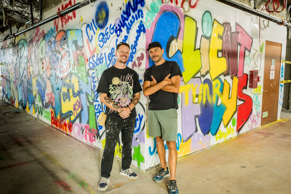Corporate event photography of professionals collaborating on mural art during company event new jersey.