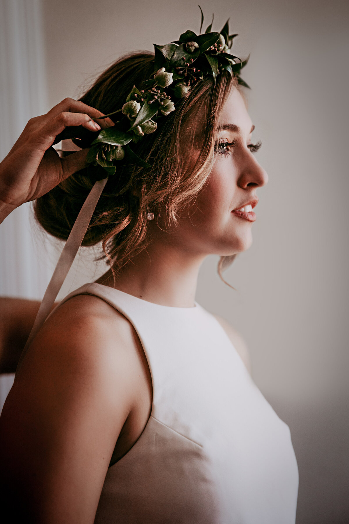 Bride Putting On Flower Crown