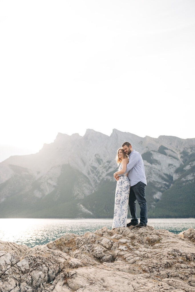 Romantic couple enjoying a scenic mountain view, captured by Lorissa Lee Photography. Featured on Brontë Bride.