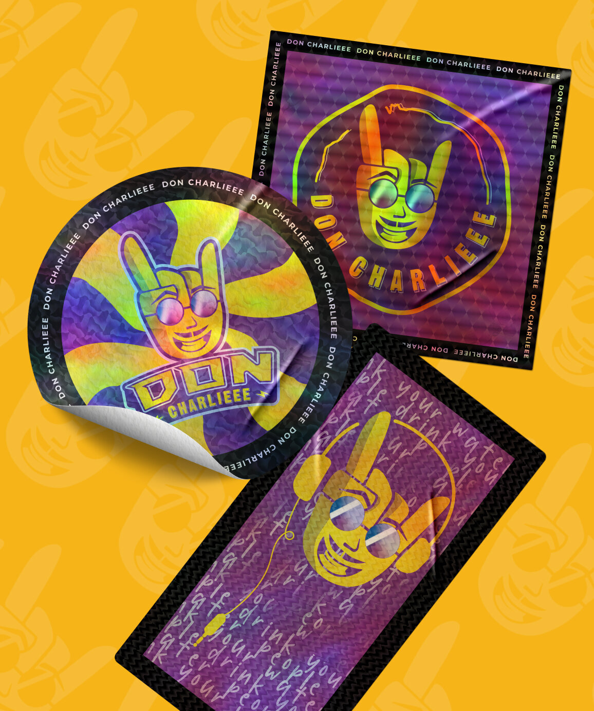 Three holographic stickers of the Don Charlieee branding on them.