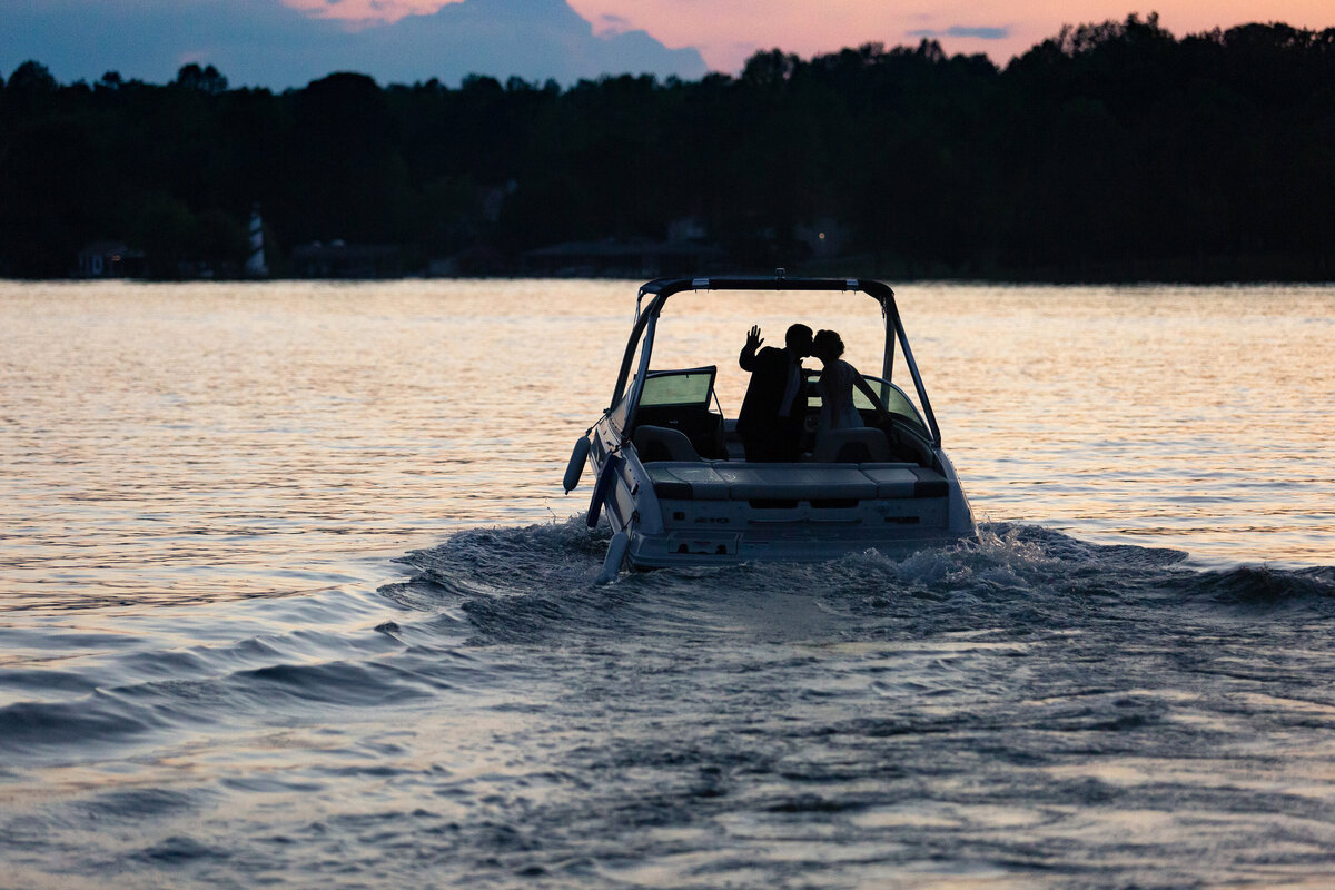 The Bride and Groom Take a Speedboat into the Sunset on Lake Anna in Virginia