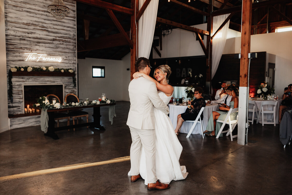 A couple shares their first dance at their wedding.