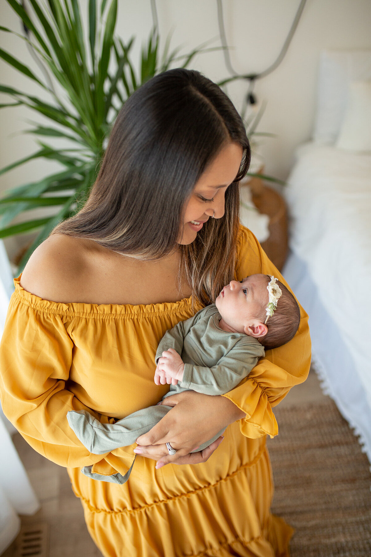 gold mama and green newborn girl