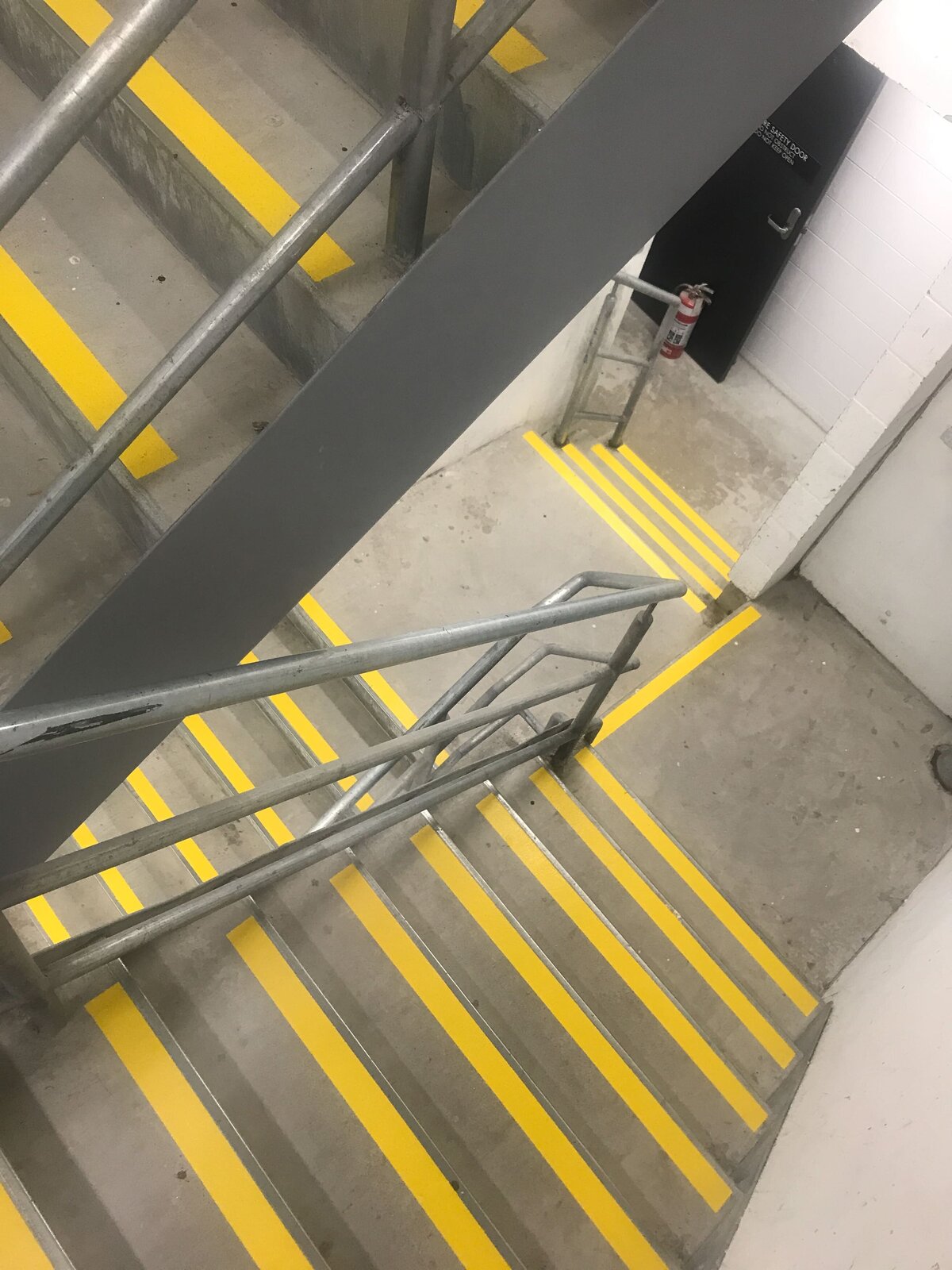 Painted linemarking stair treads, down an interior emergency stairwell