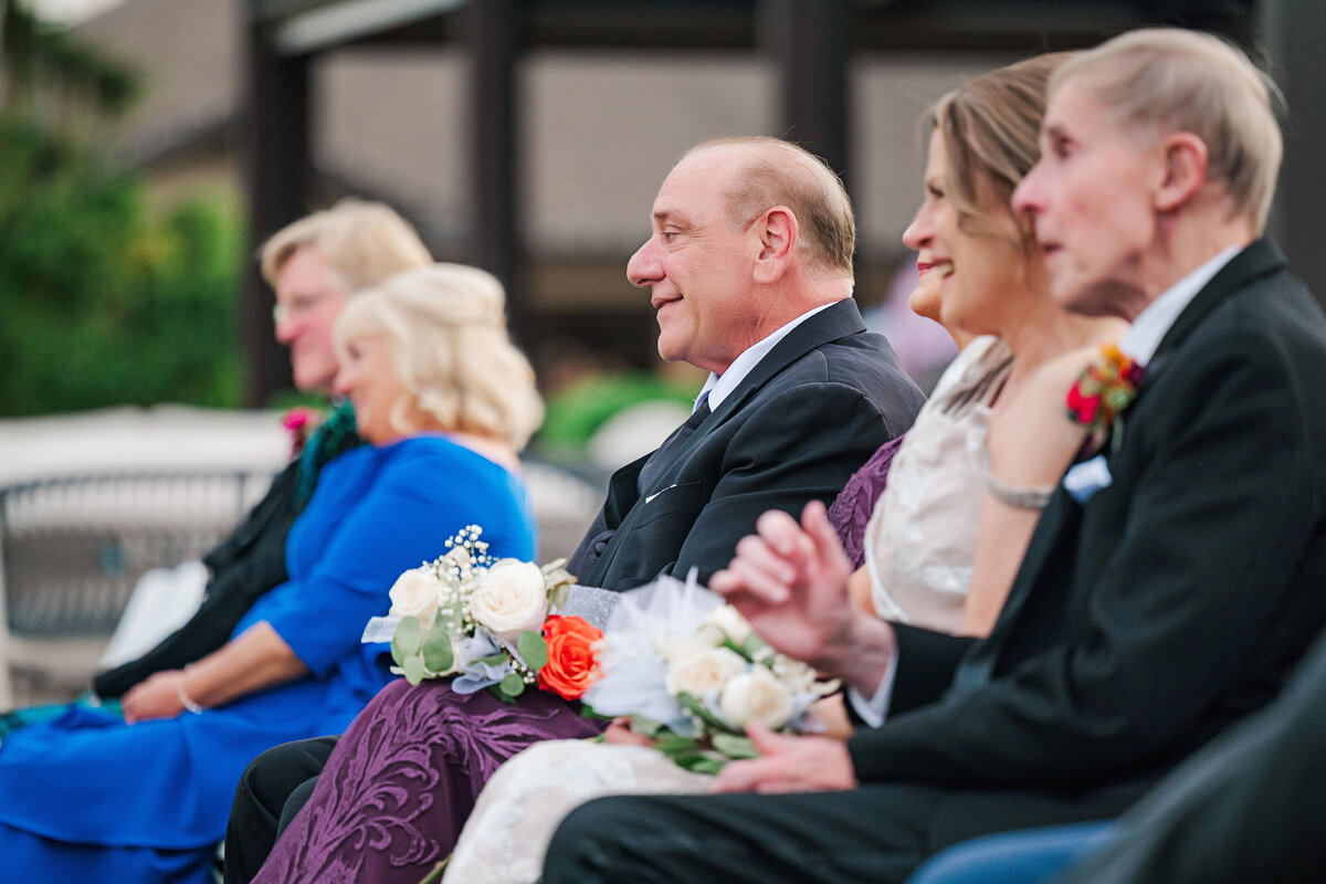 father of the bride watching wedding ceremony