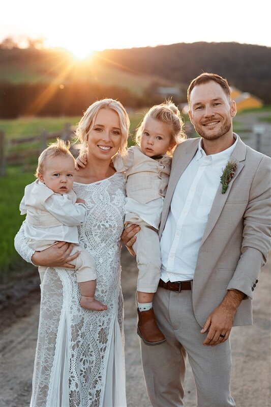 "Capture the joy and love radiating from Maddi and Jeremy's wedding day with this heartwarming family photo.