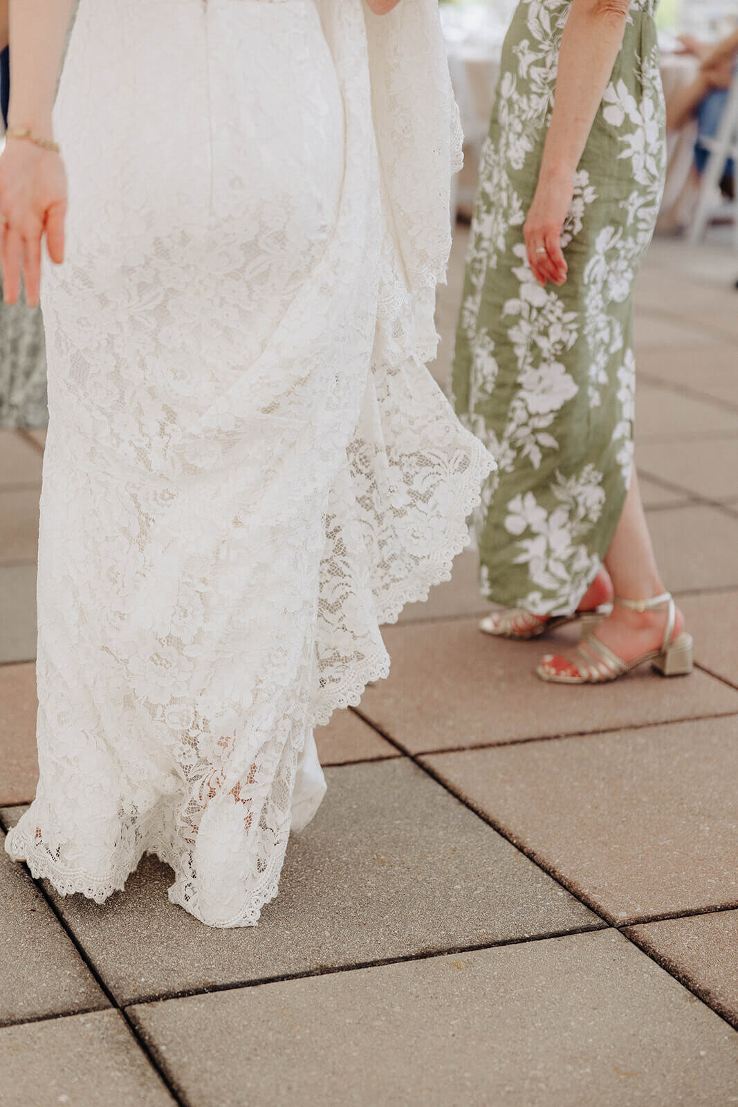 Shot of wedding guest and bride lower half at Cornell University wedding reception