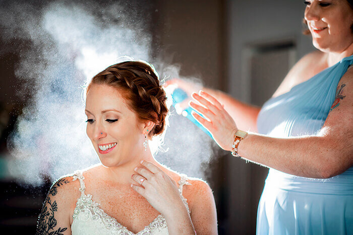 bride-gets-hair-done-hairspray-lights